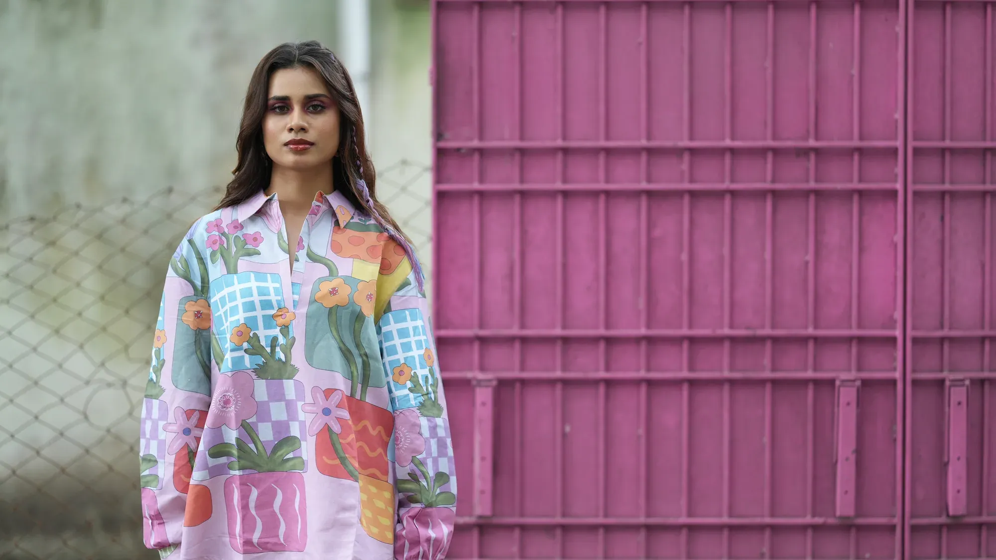 Pastel patchwork shirt by a pink door